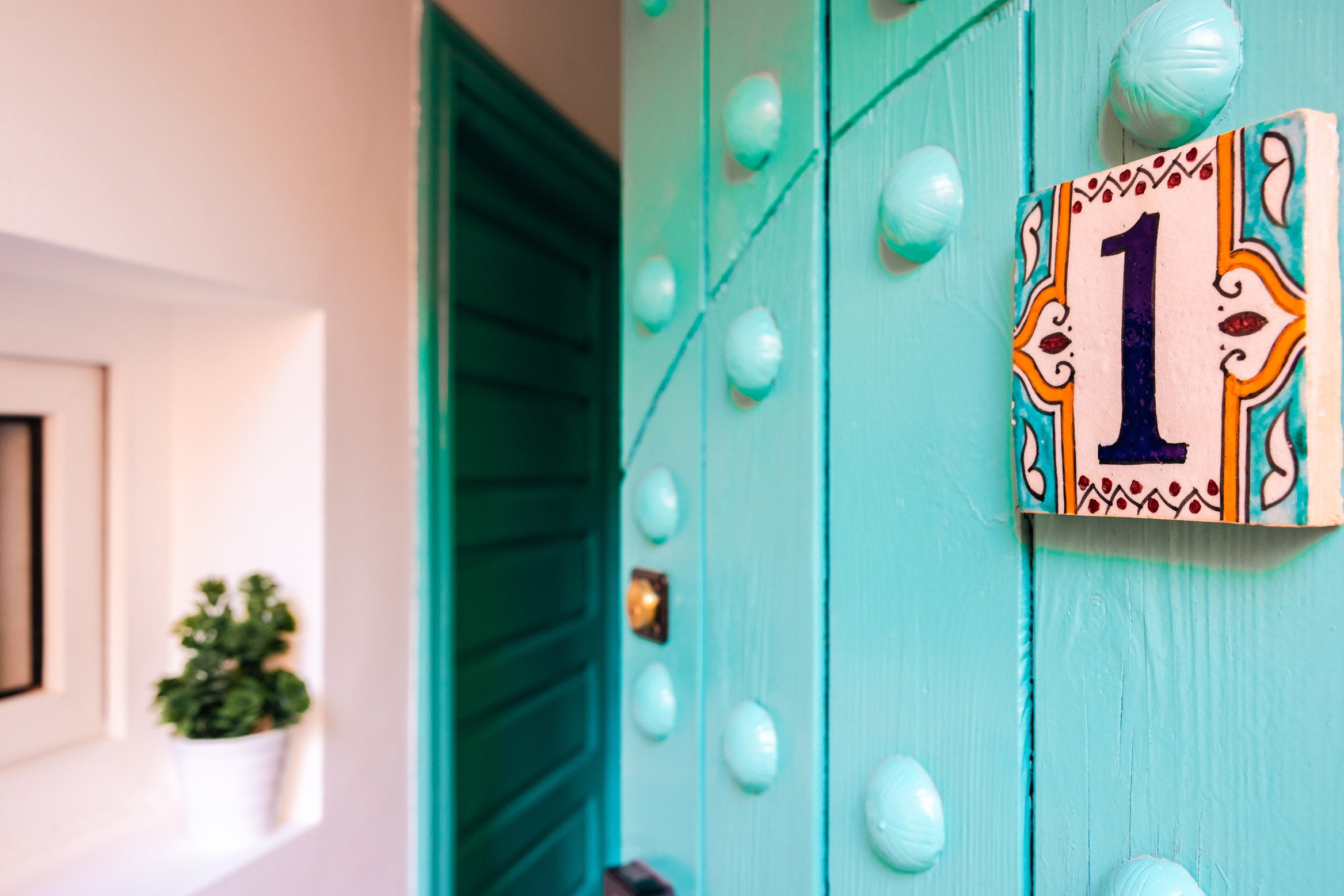 Dar Bassidi teal front door